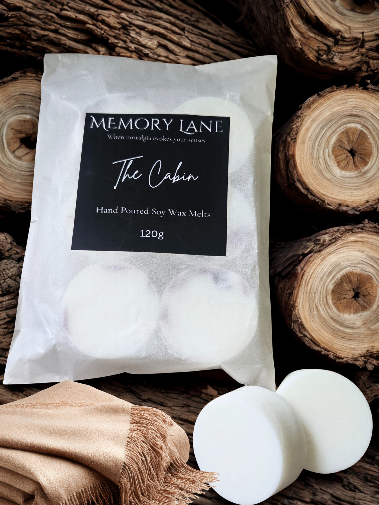 Packaging of Memory Lane 'The Cabin' hand poured soy wax melts on a wooden background.