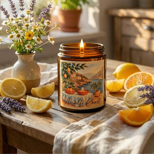 Candle labeled 'Amalfi Coast' on a wooden table with lemons and lavender.