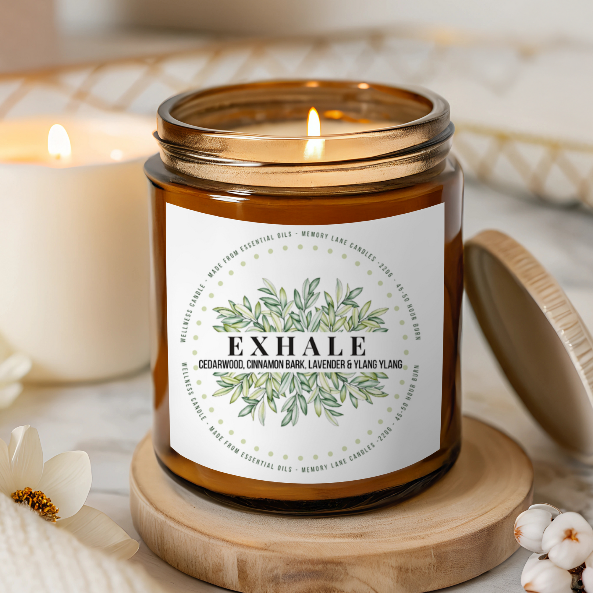 Candle labeled 'Exhale' on a wooden coaster with a blurred background